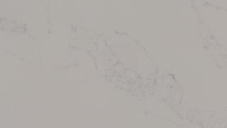 A close up of a white marble counter top.