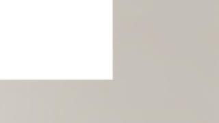 A white square is sitting on top of a gray surface.