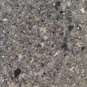 A close up of a granite counter top with a lot of small rocks on it.