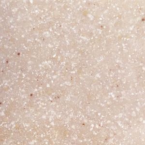 A close up of a white surface with small dots on it.
