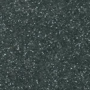 A close up of a black granite counter top with white spots.