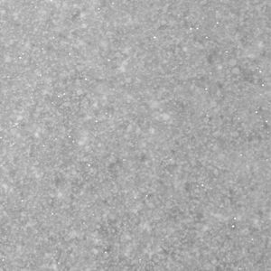 A close up of a gray surface with a lot of small dots on it.