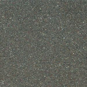 A close up of a gray surface with small stones on it.