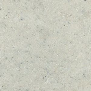 A close up of a white granite counter top.