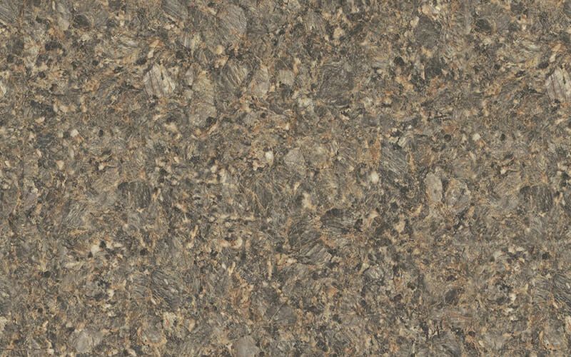 A close up of a brown granite counter top.