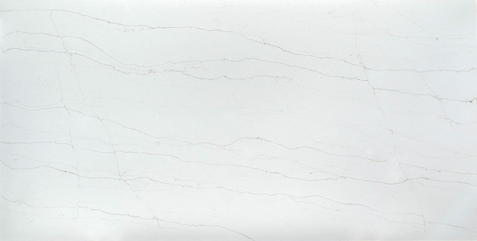 A close up of a white marble counter top.