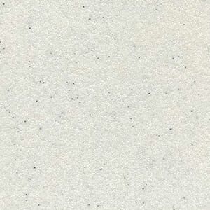 A close up of a white paper with small black dots on it.