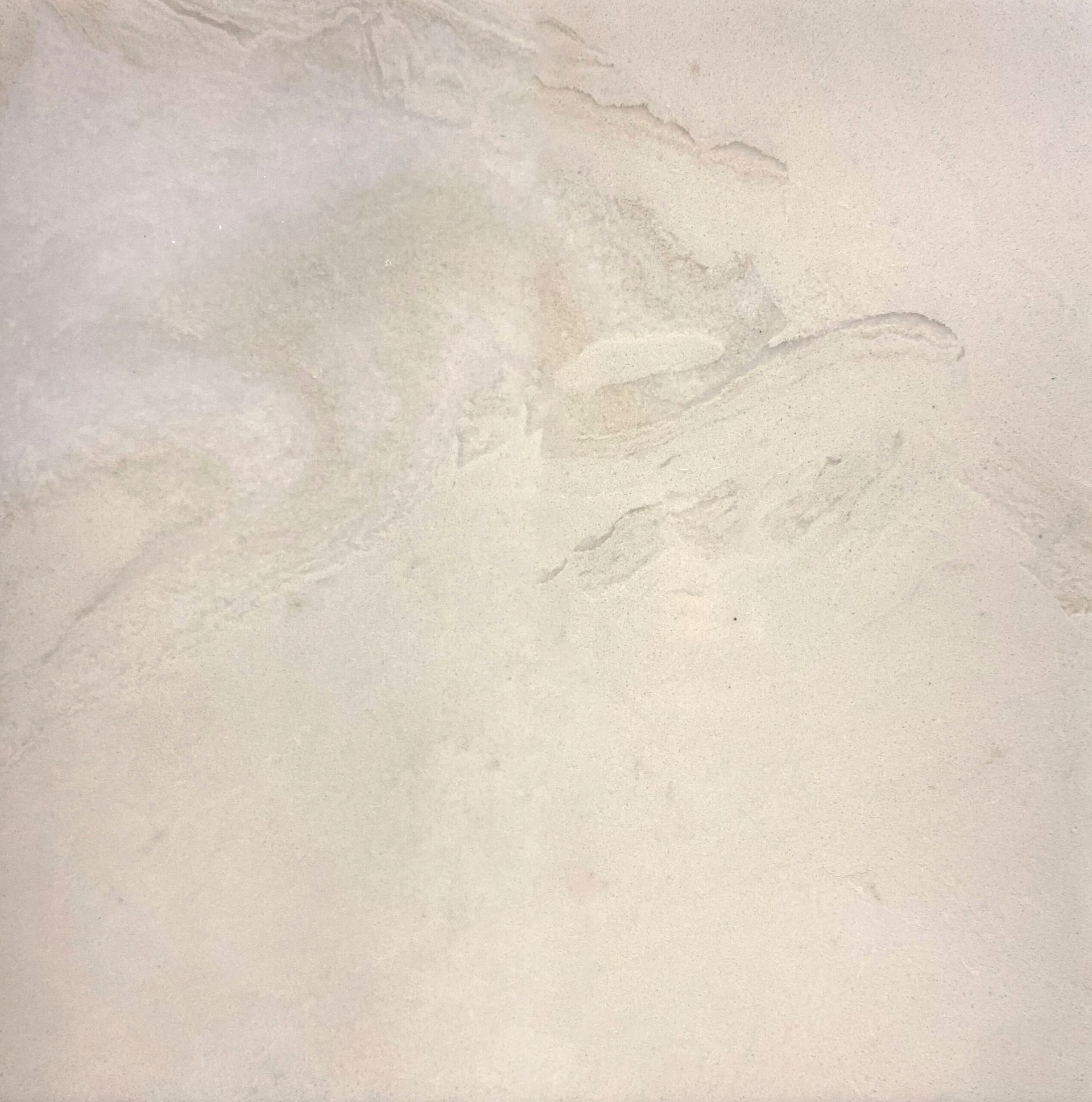 A close up of a white tile with a marble texture.