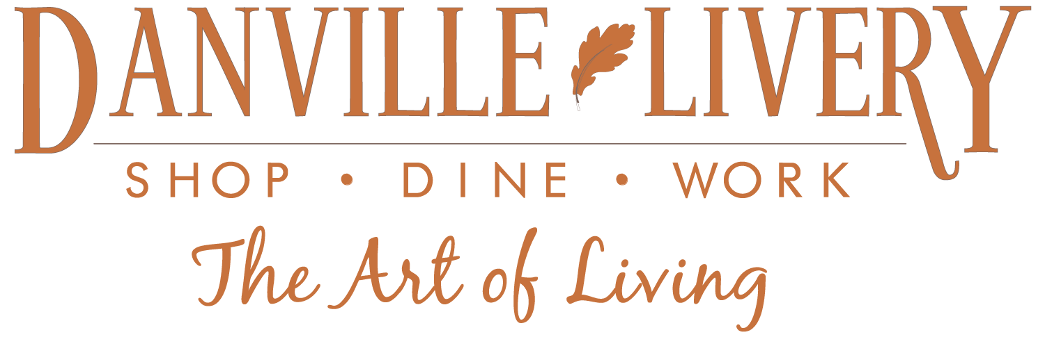 The logo for danville livery shop dine work the art of living