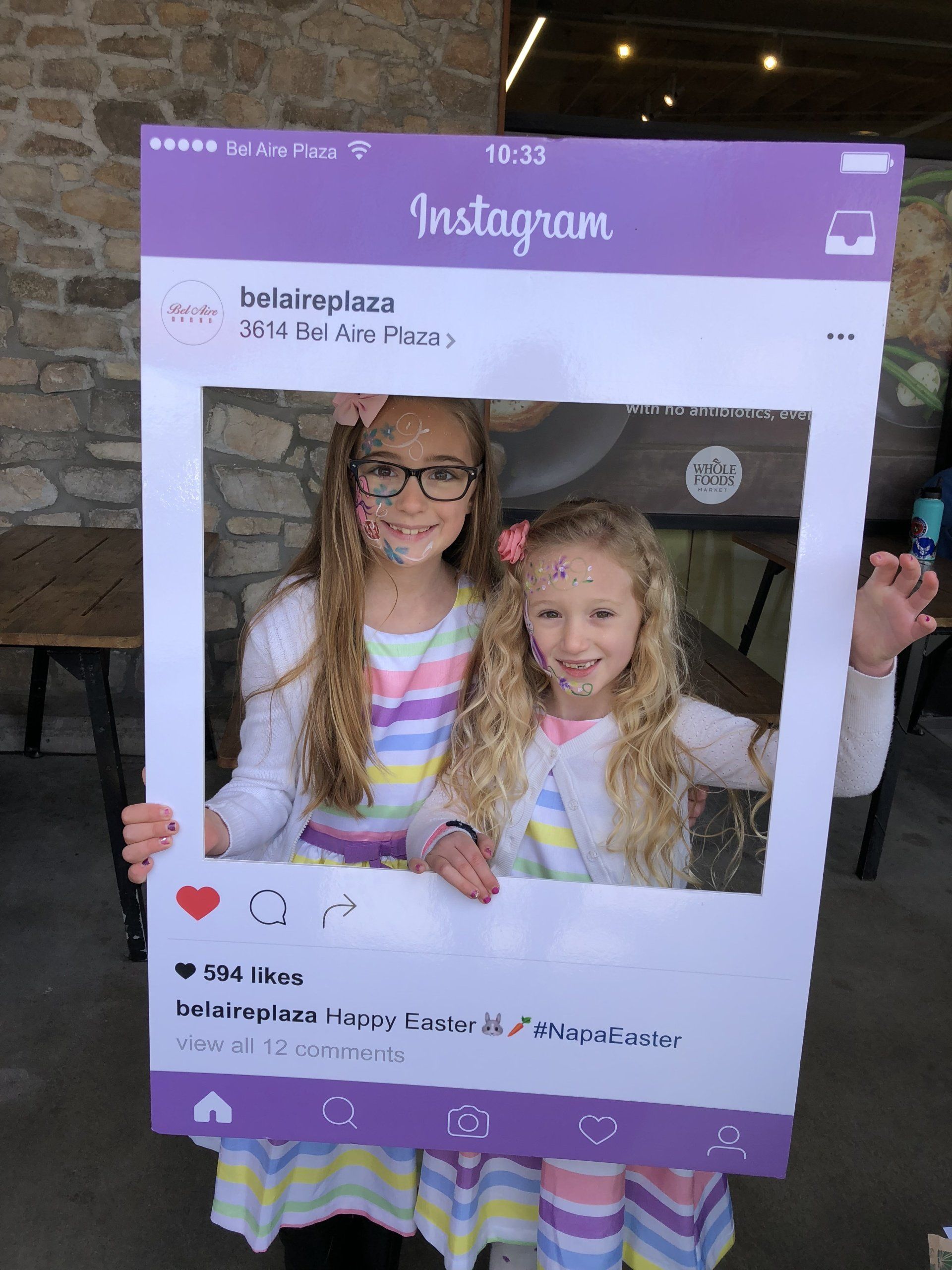 Two little girls are posing for a picture in an instagram frame.