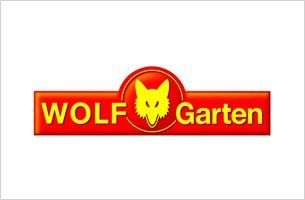 Logo di Wolf Garten: rettangolo rosso con testo giallo e testa di lupo in un cerchio.