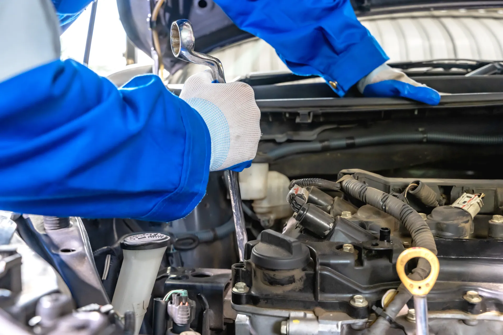 Mechanic Works on Car Engine with a Wrench | Autoworx 22