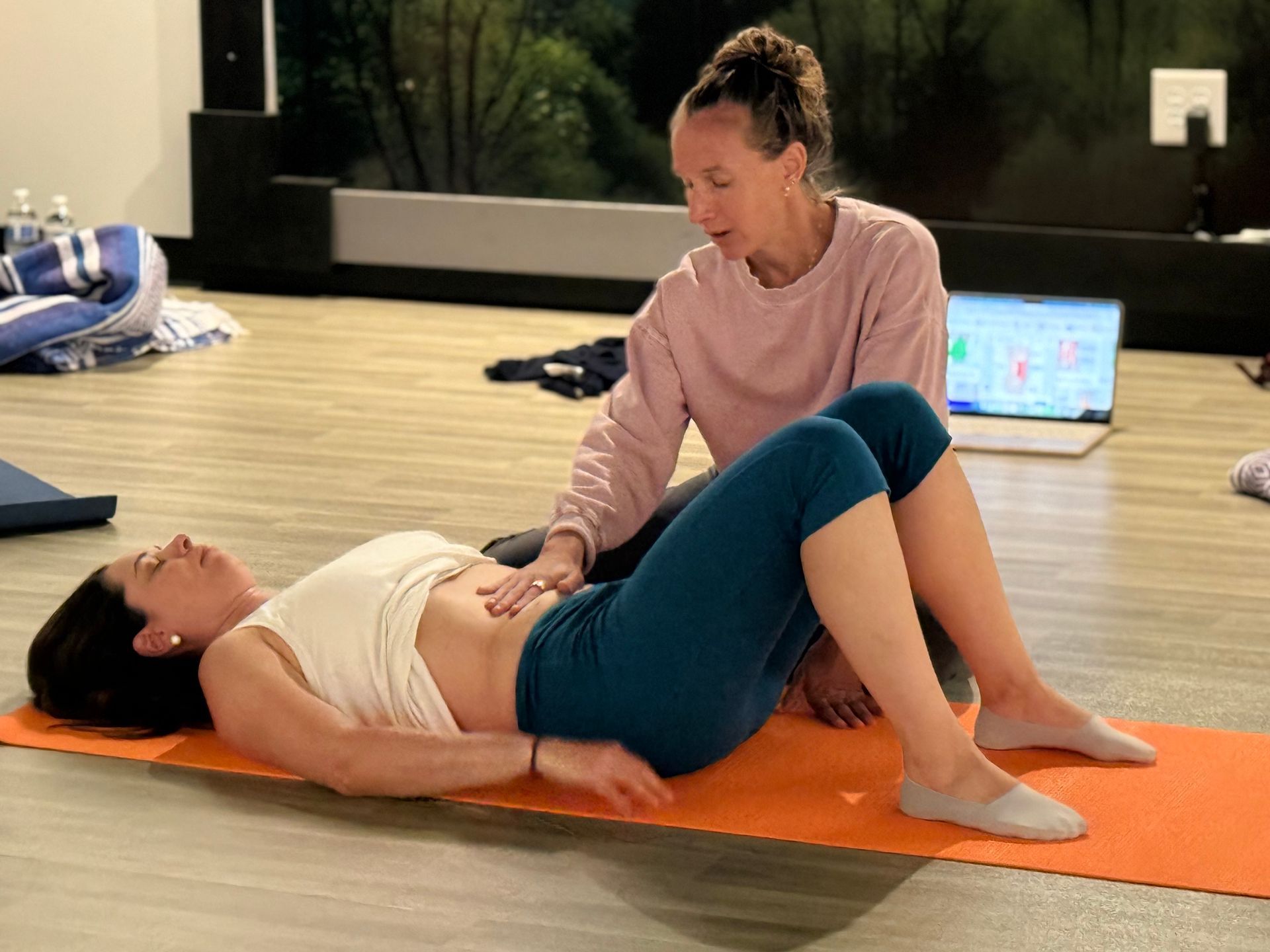 Palestra practitioner guiding a client through bodywork at the Whole Body Reset workshop