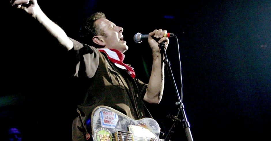 I know that my life make you nervous, But I tell you I can’t live in service Joe Strummer with black Telecaster