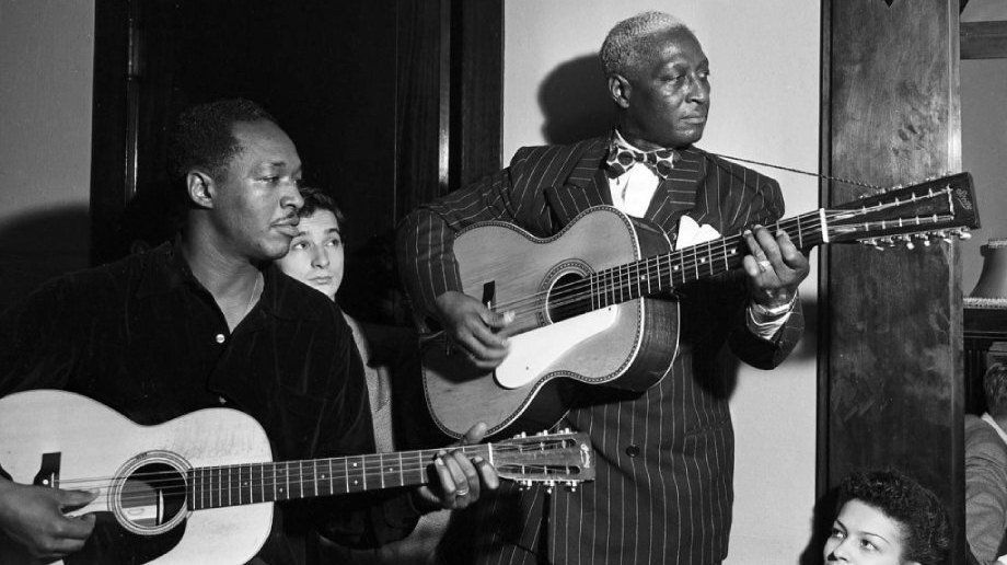 Josh White with a Martin 00-21 and Lead Belly with his famous long scale Stella Auditorium 12-string which Kurt Cobain didn't buy for half a mill. Josh White and Huddie Leadbetter playing together