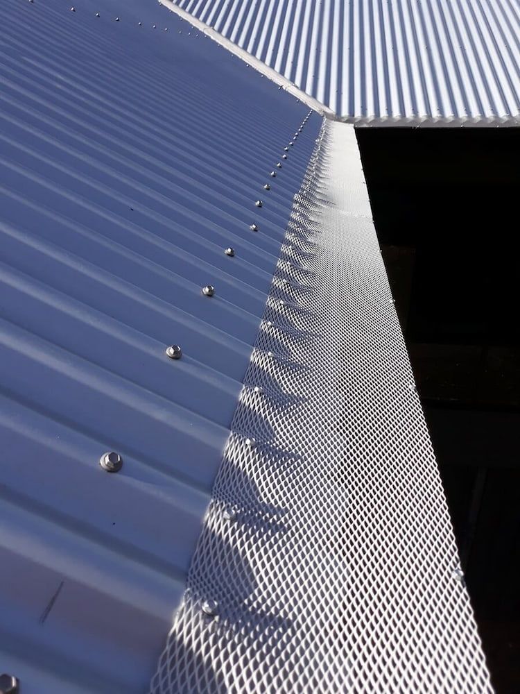 A Close Up of a Gutter on a Metal Roof — AD House Wash & Gutter Cover in East Toowoomba, QLD