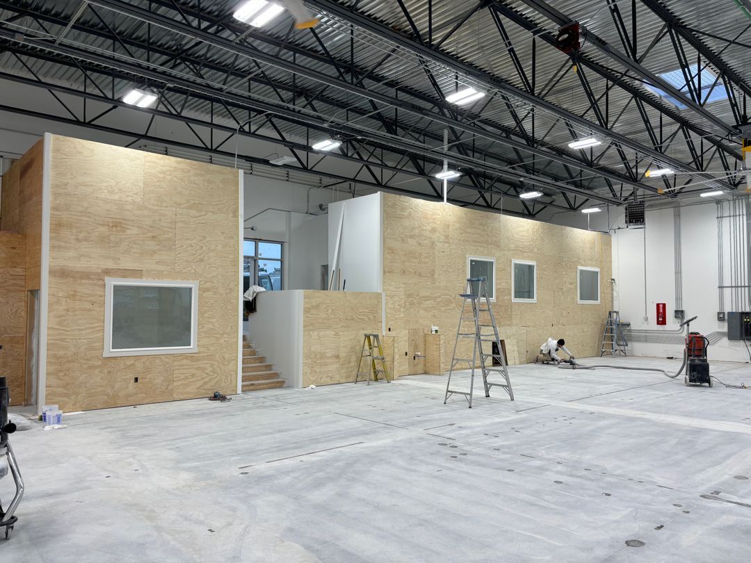 A large room with a ladder in the middle of it