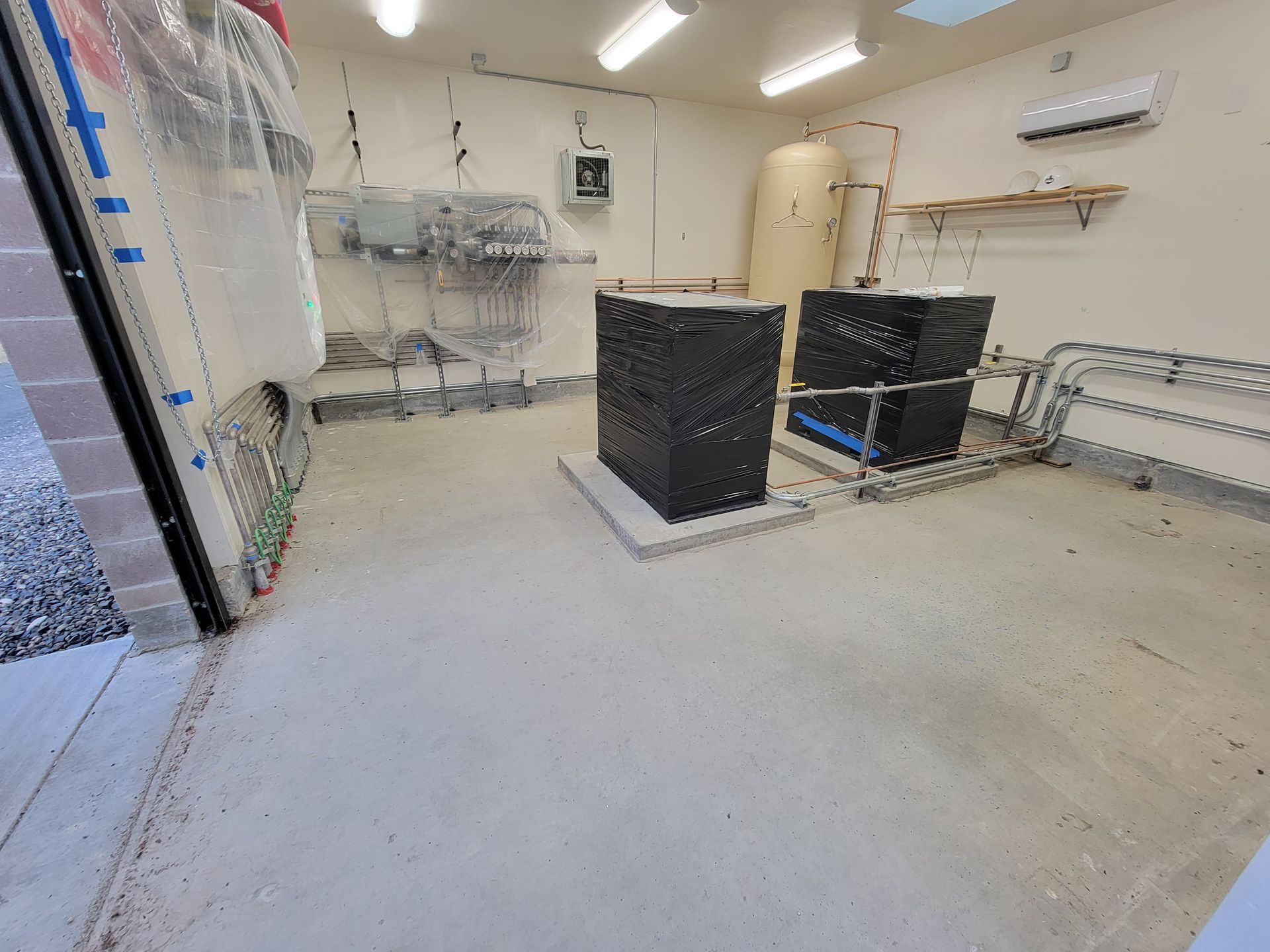 A room with a lot of electrical equipment in it.