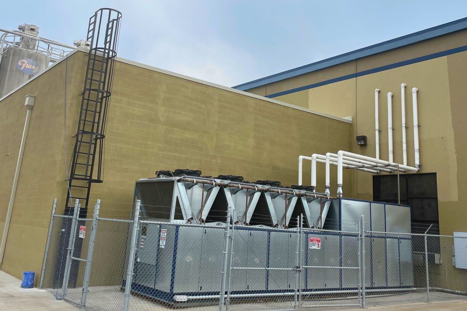 A large building with a ladder on the side of it