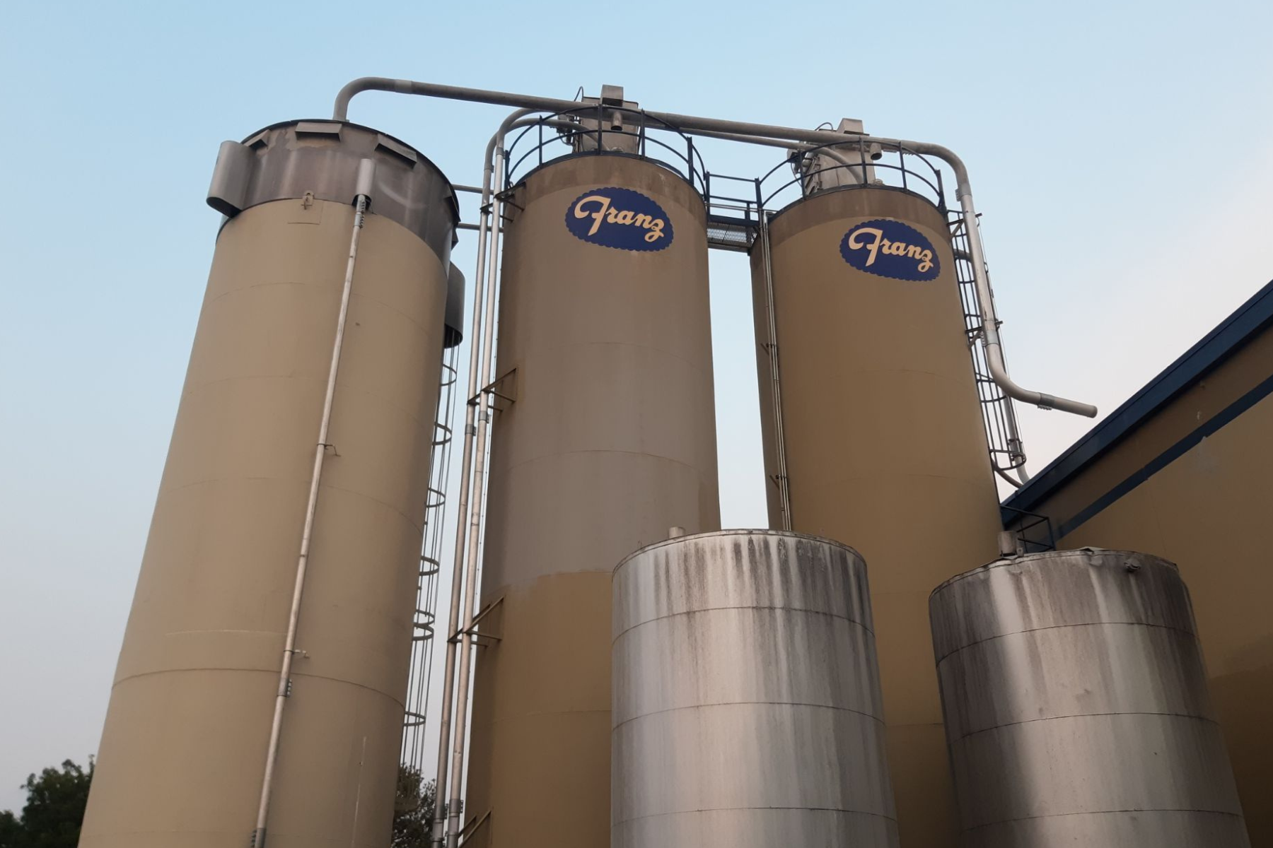 Three silos with the word ghany on them