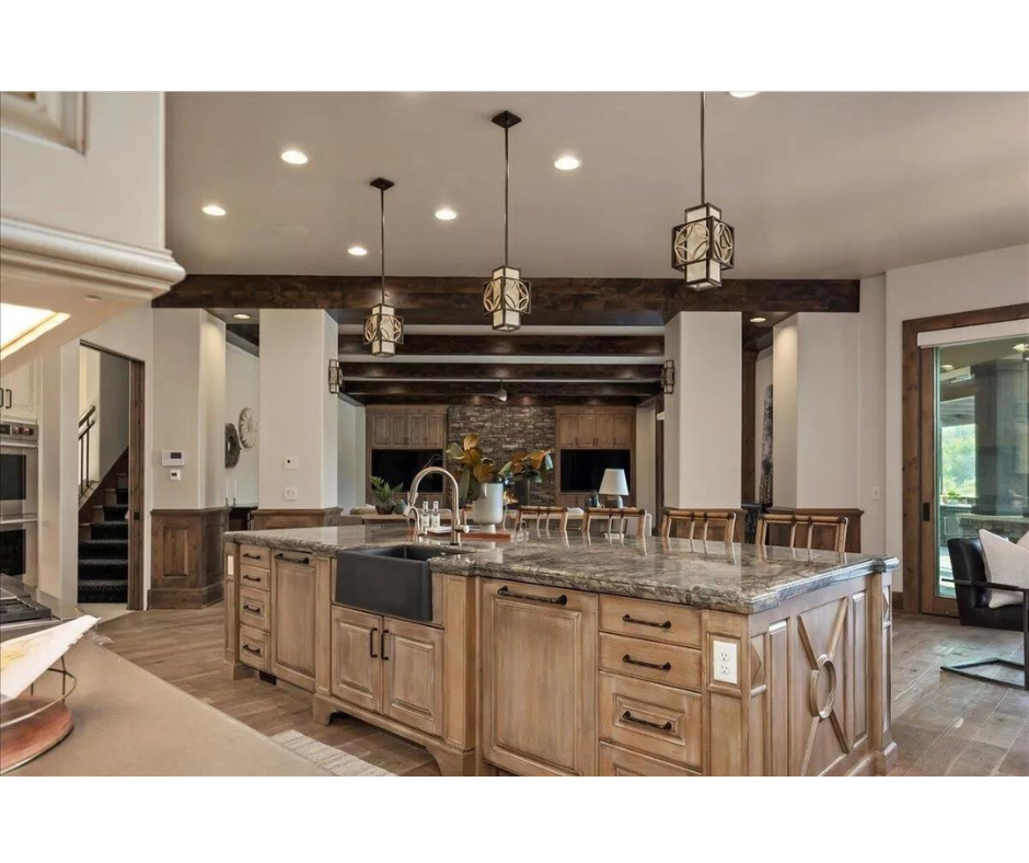 A kitchen with a large island and a sink