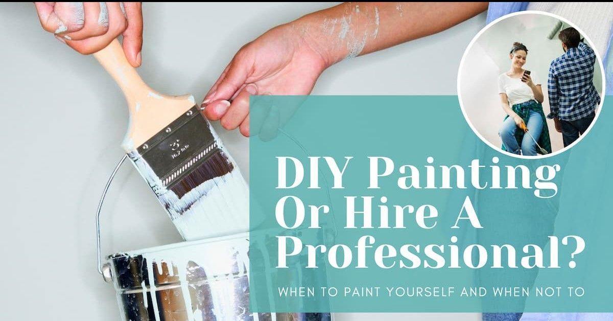 A person is holding a paint brush next to a bucket of paint.