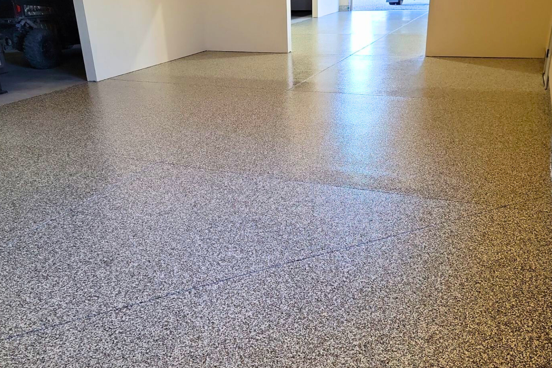 A garage floor with a lot of small stones on it.