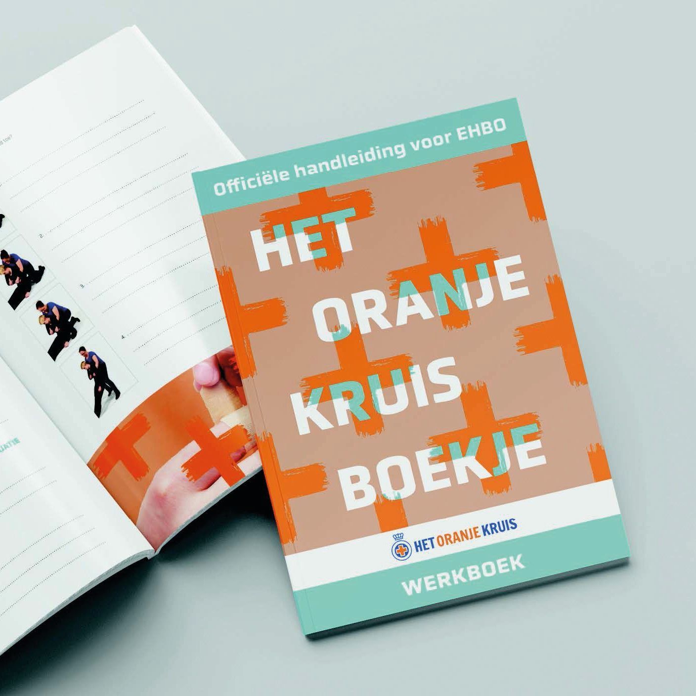 A book is open to a page that says het oranje kruis boekje