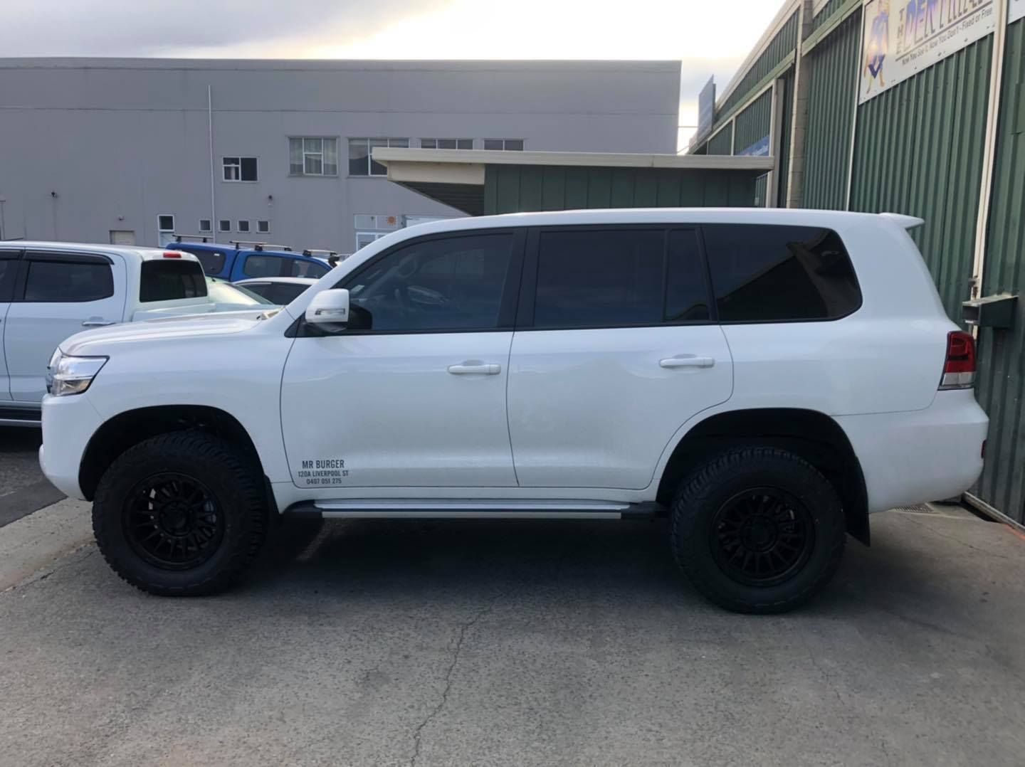 A White Toyota Land Cruiser Suv Parked on Concrete — Magic Tintz in Moonah, TAS