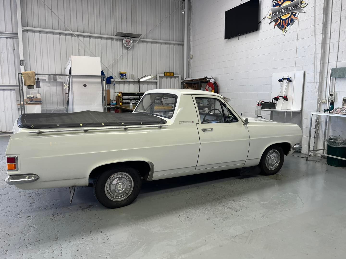 A White Vintage Utility Truck Parked Inside a Clean Industrial Workshop — Magic Tintz in Moonah, TAS
