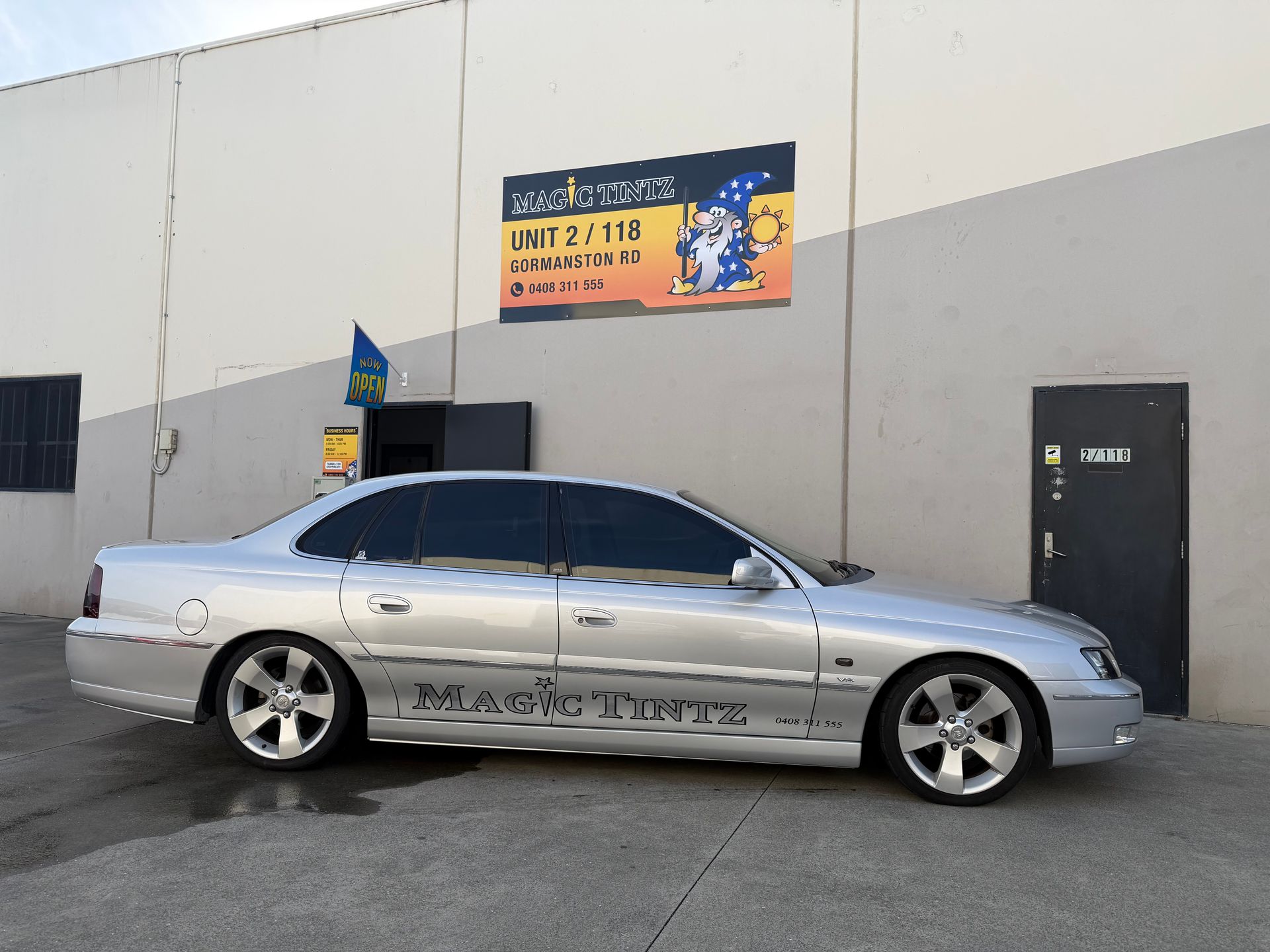 Silver lowered sedan with tinted windows parked beside a building with a sign and closed door Automotive Window Tinting
Hybrid Films; with metalized/die construction available in 7 shades, 60,50,35,30,20,15 & 5%. A high performance auto film with a colour stable non-reflective dyed film , and a layer of metallized film, this series provides good looks and high heat rejection.
Ceramic Film; for the ultimate in UV rejection & IR rejection. The perfect blend of luxury, performance and style. Engineered with cutting edge technology, it delivers superior heat rejection to keep your vehicle cool and comfortable.
The film’s deep black colour not only enhances your car’s aesthetics but also adds a sleek, sophisticated look, elevating your driving experience in every way. 6 shades available, 70,50,35,20,15 & 5% VLT