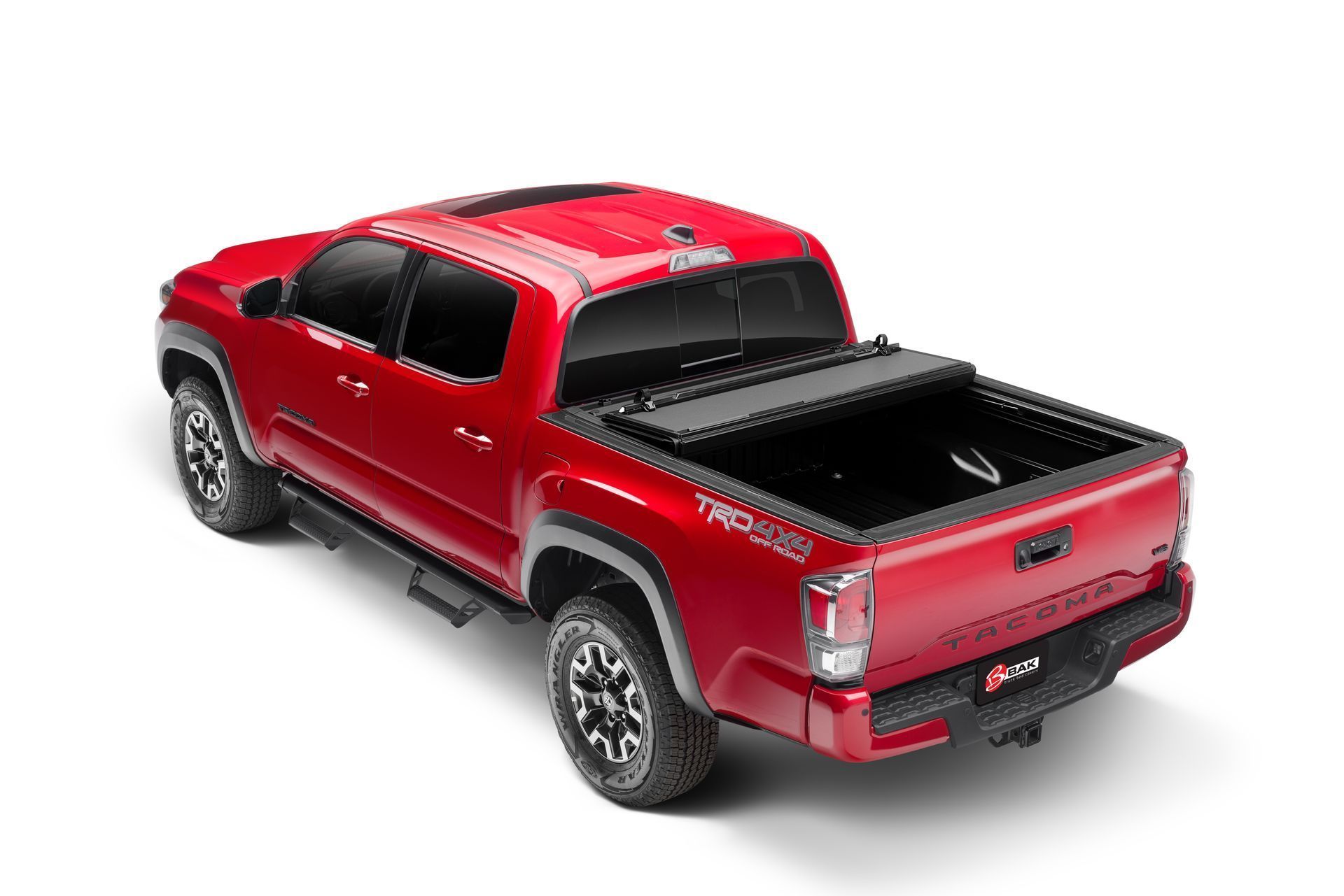 A red truck with a black bed cover on a white background.