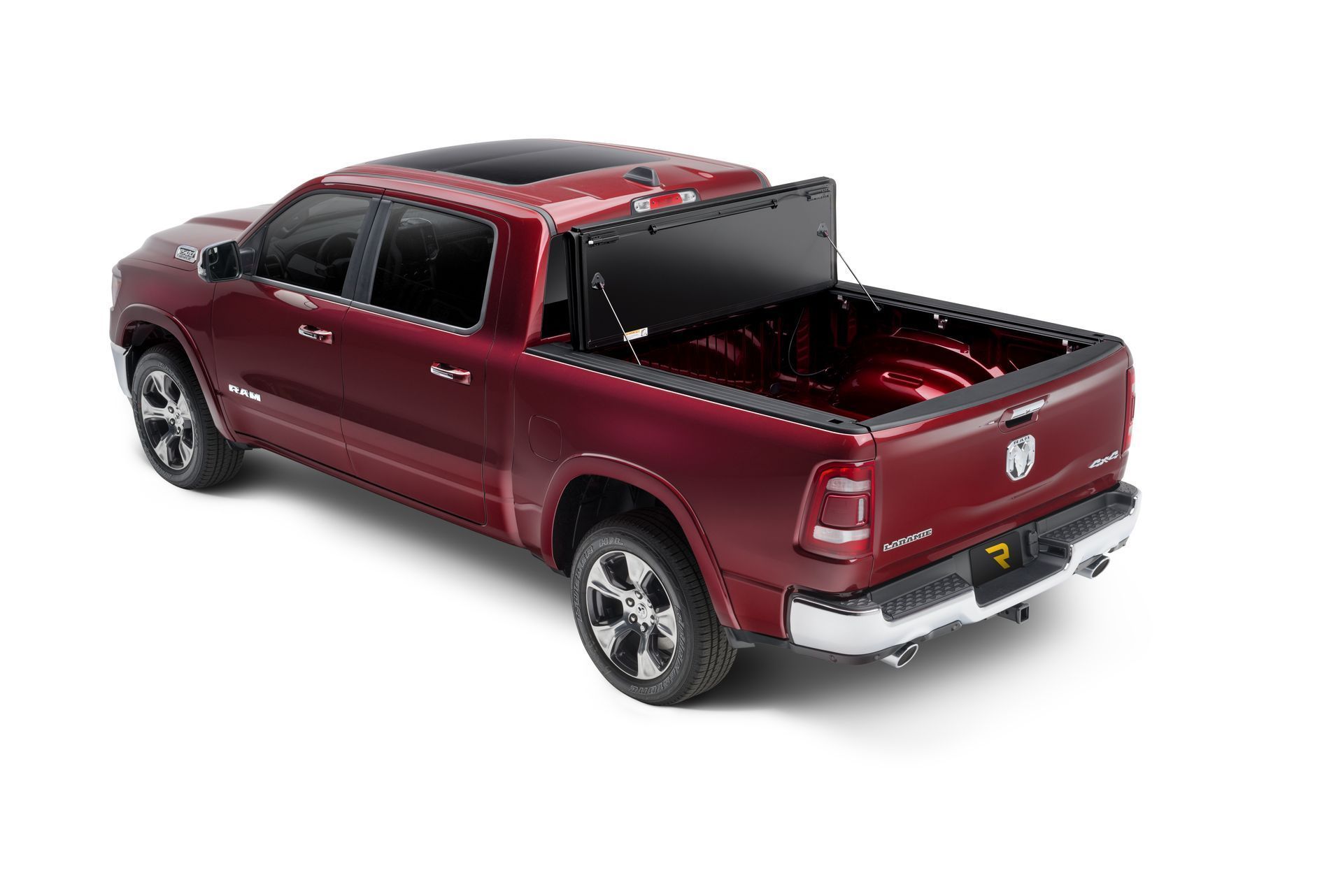 A red truck with a black bed cover on a white background.