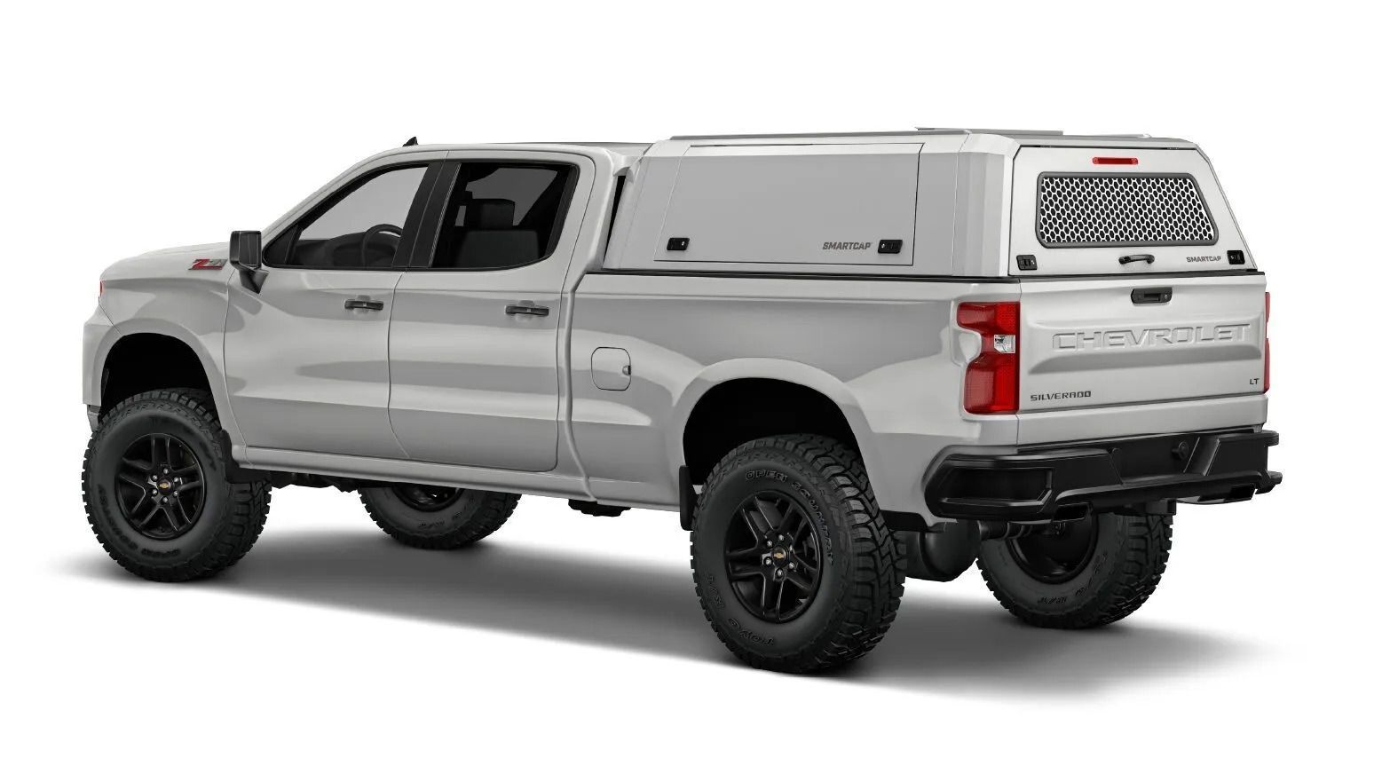 A silver truck with a canopy on top of it.