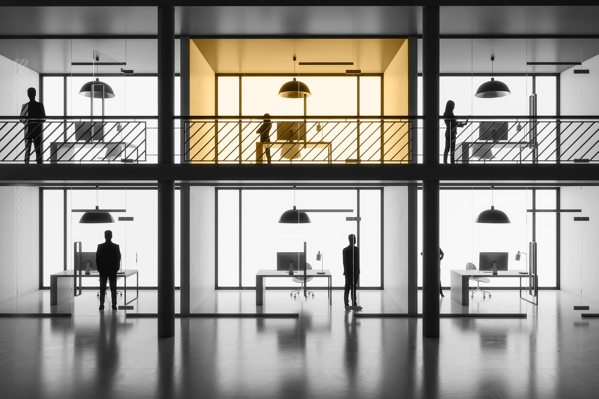 Modern multi-story corporate office with silhouetted professionals