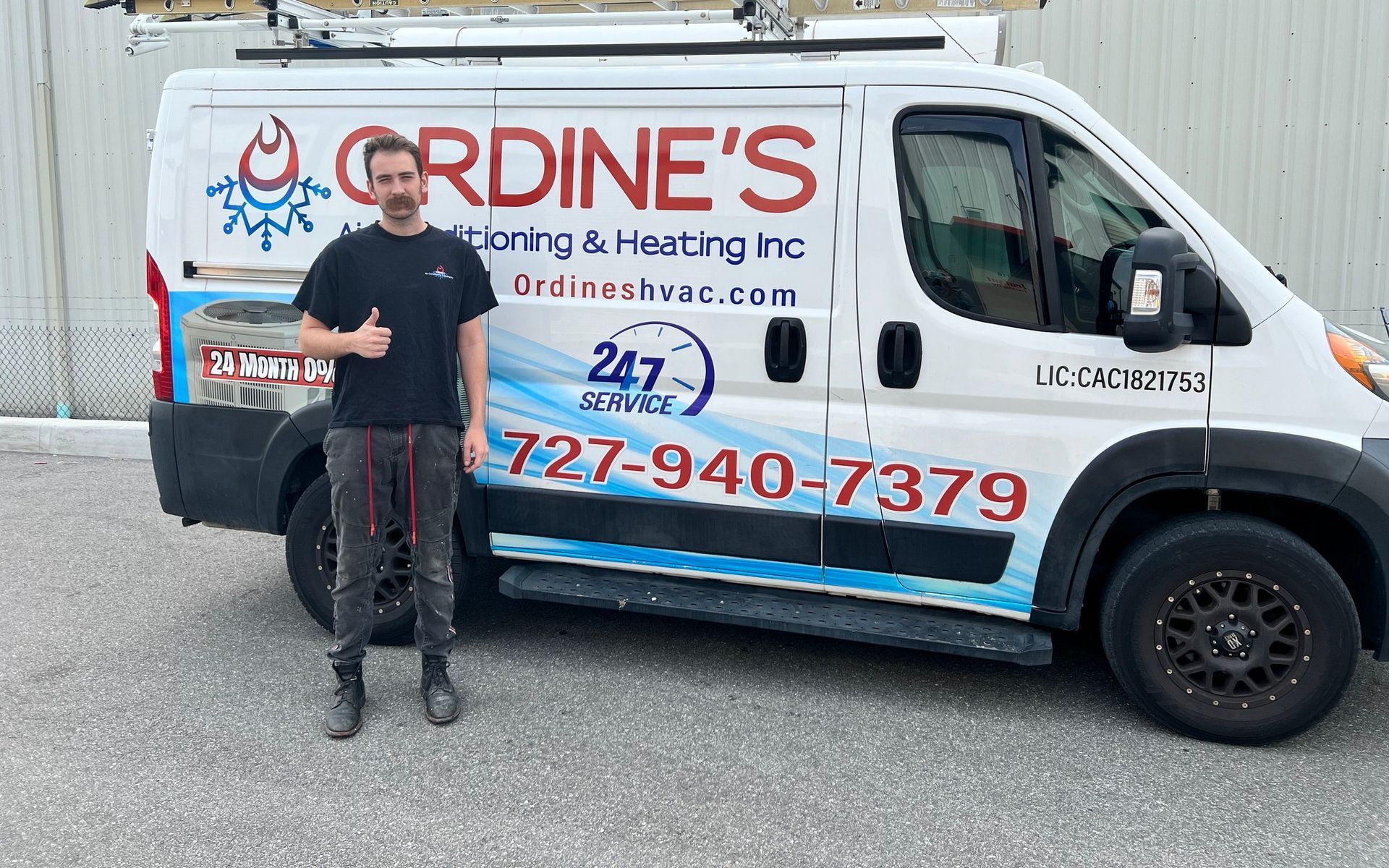 A HVAC contractor in front of a van in Holiday, FL