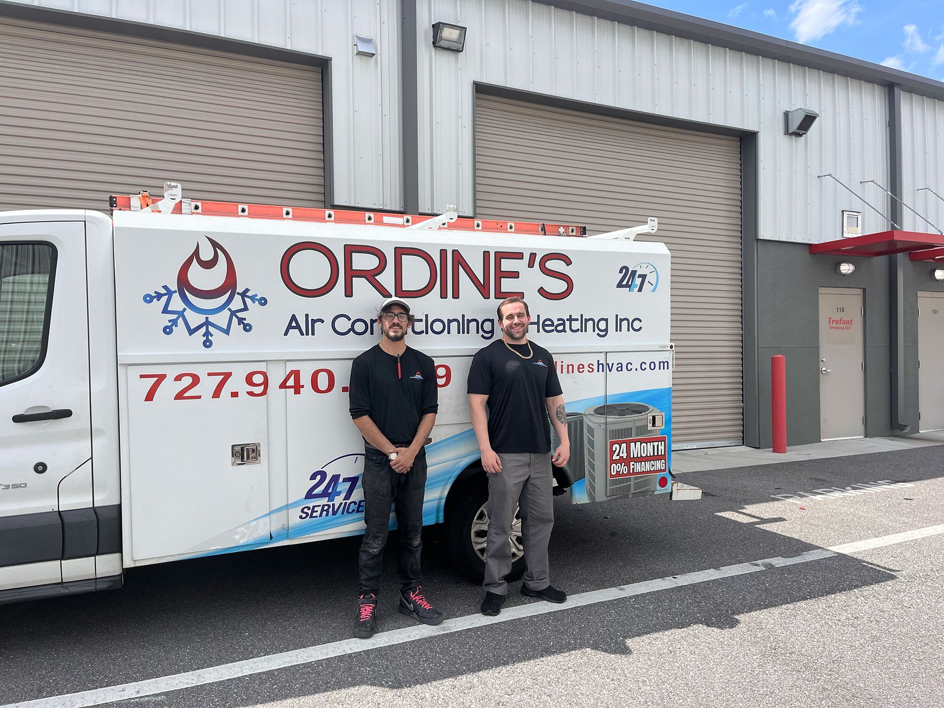 An HVAC contractor team in front of a van in Holiday, FL