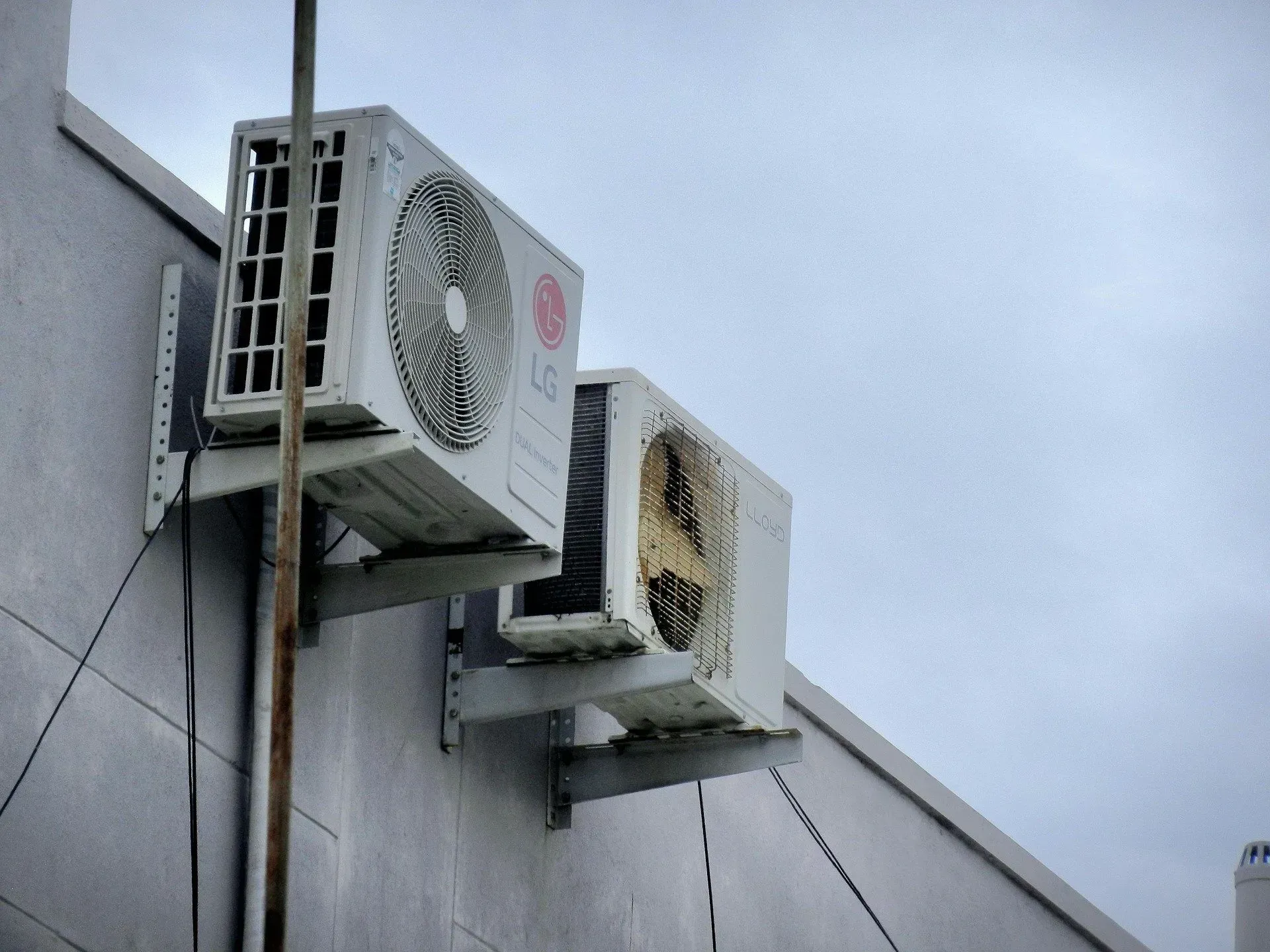 Two AC units on an exterior wall