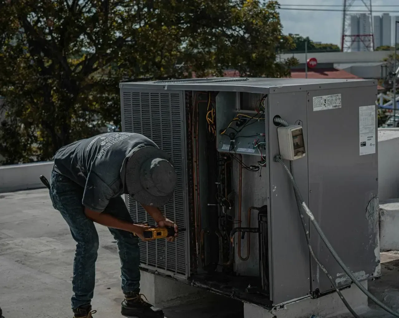 A man handling an AC repair