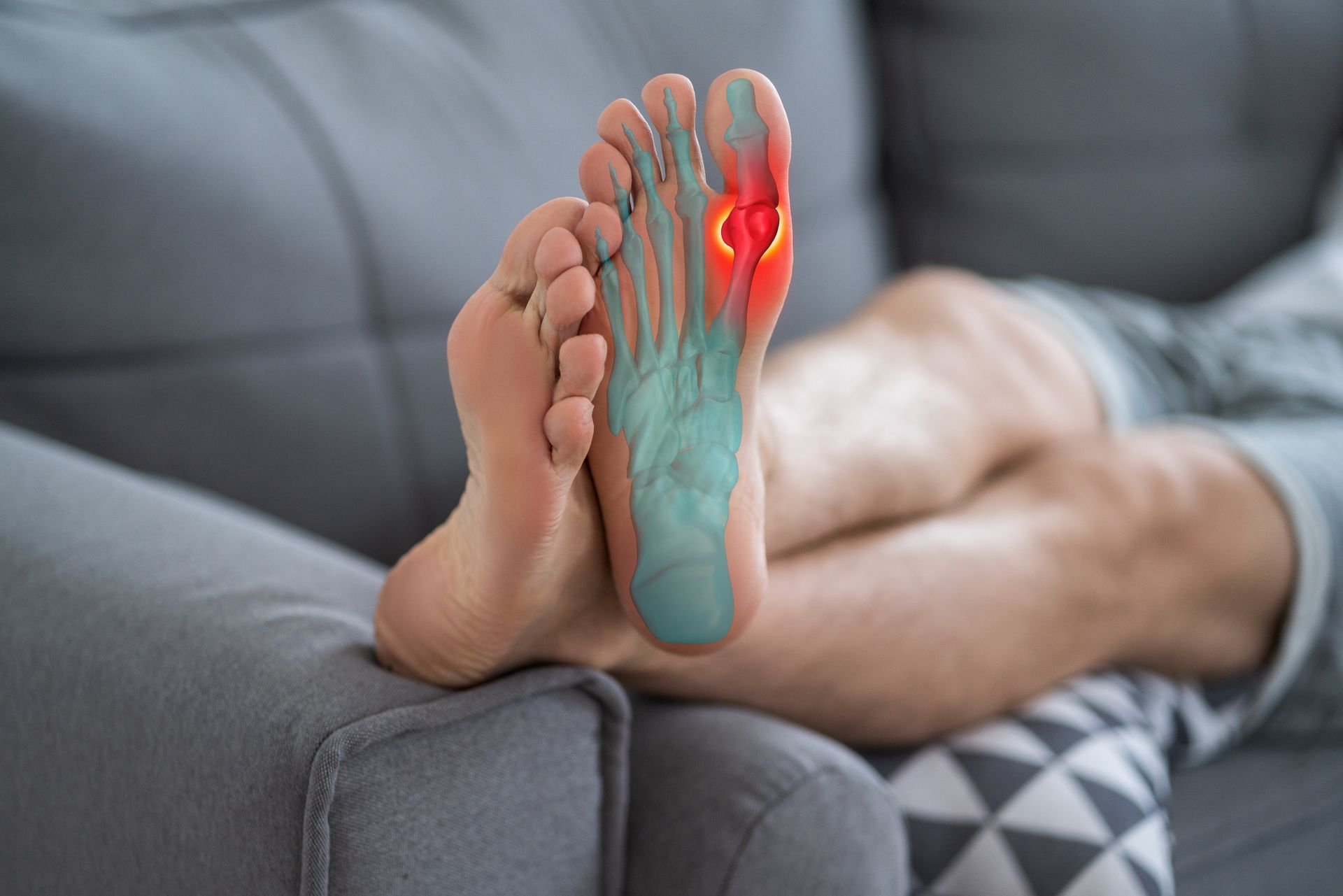 Foot with highlighted areas indicating pain. On couch.