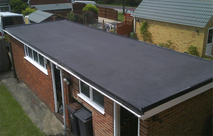 Aerial view of a durable rubber roofing membrane installed on a flat roof, providing reliable weather protection and insulation.