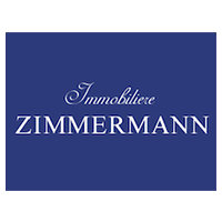 Un logo bleu pour zimmermann, une société immobilière.
