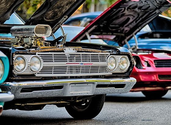 Classic cars parked outside with hoods lifted up | Certified Automotive Solutions