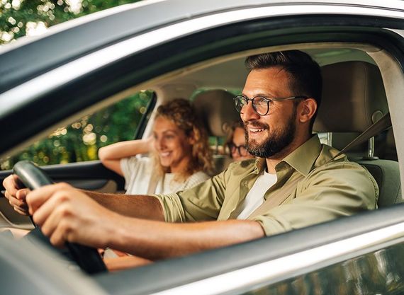 Man driving vehicle with his family, on the road | Certified Automotive Solutions