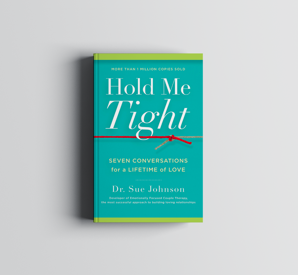 A book titled Hold Me Tight by Dr. Sue Johnson