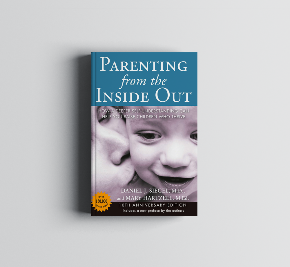 A blue book titled parenting from the inside out