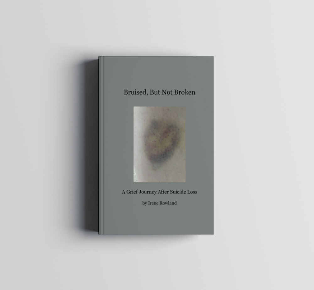 A book titled braided but not broken is sitting on a white surface