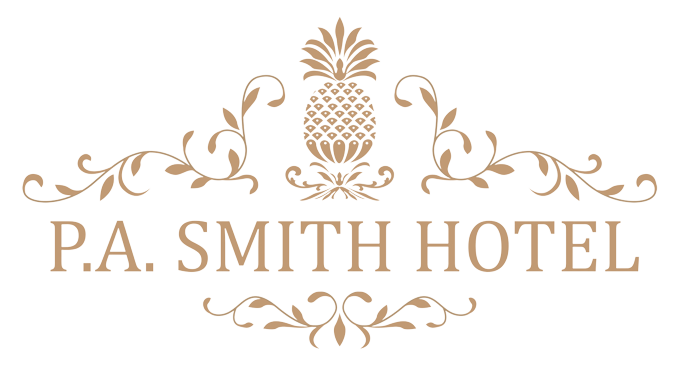 Logo for P.A. Smith Hotel featuring a gold pineapple graphic with elegant scrollwork on a white background.