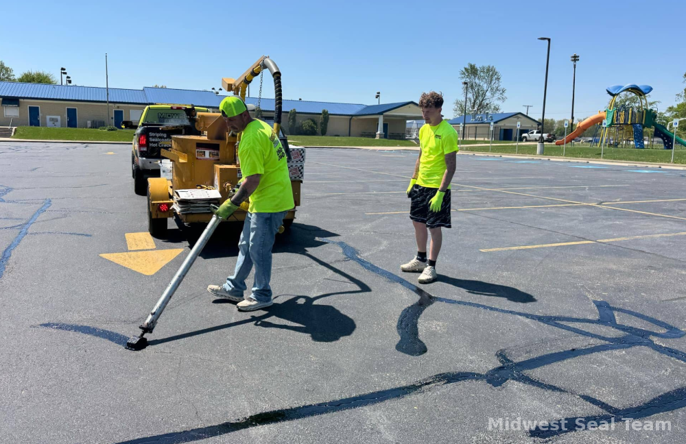 Image of Midwest Seal Team crack filling in a parking lot. You can see the Midwest Seal Team crack filling crew sealing bracks in a parking area here in Fort Wayne, Indiana.