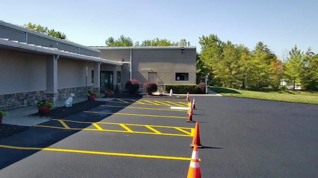 Picture parking lot painting being performed by Midwest Seal Team in a parking lot in Fort Wayne, IN.
